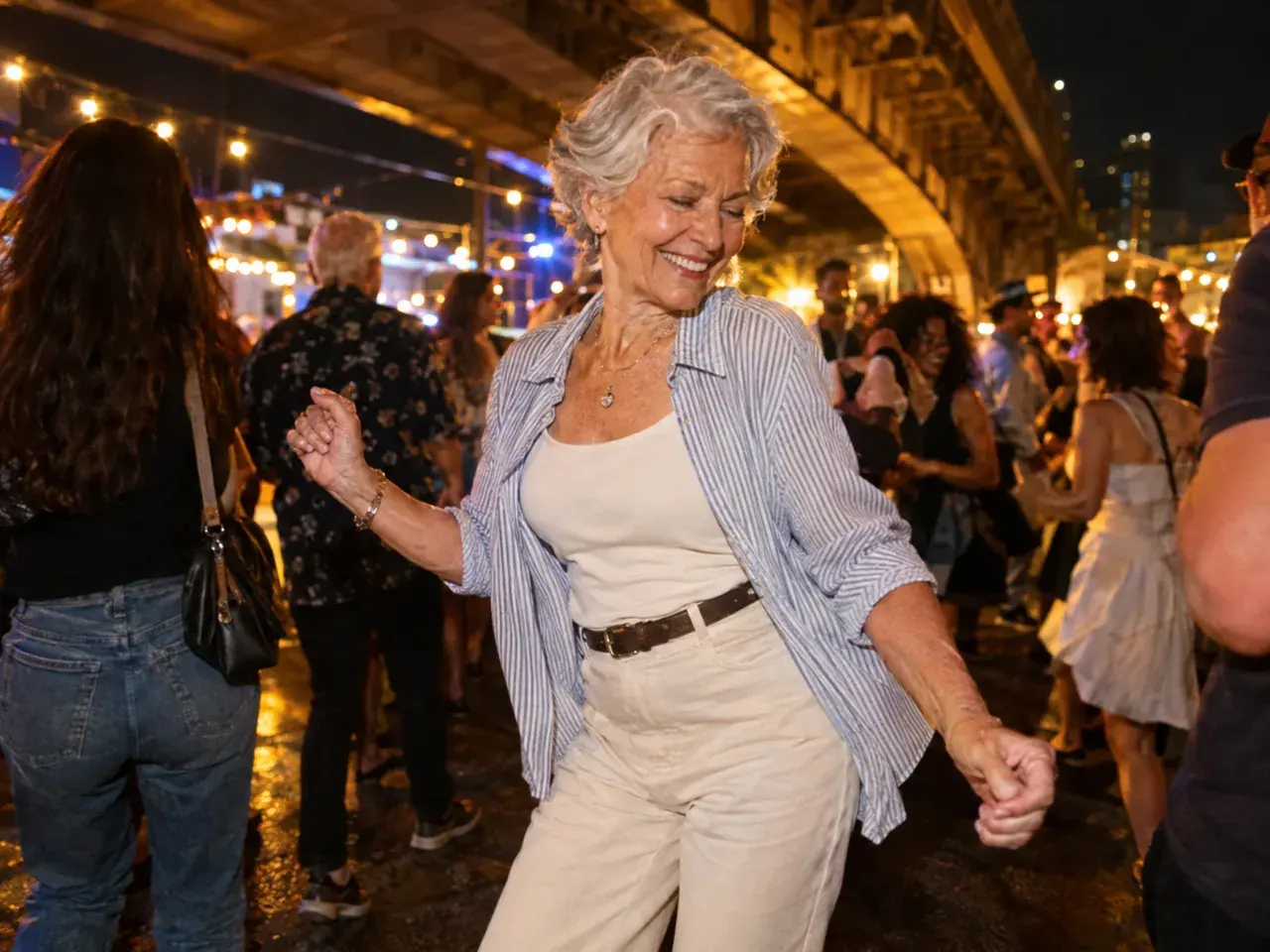 Older adult in a stylish outfit dancing joyfully in a crowded night street party